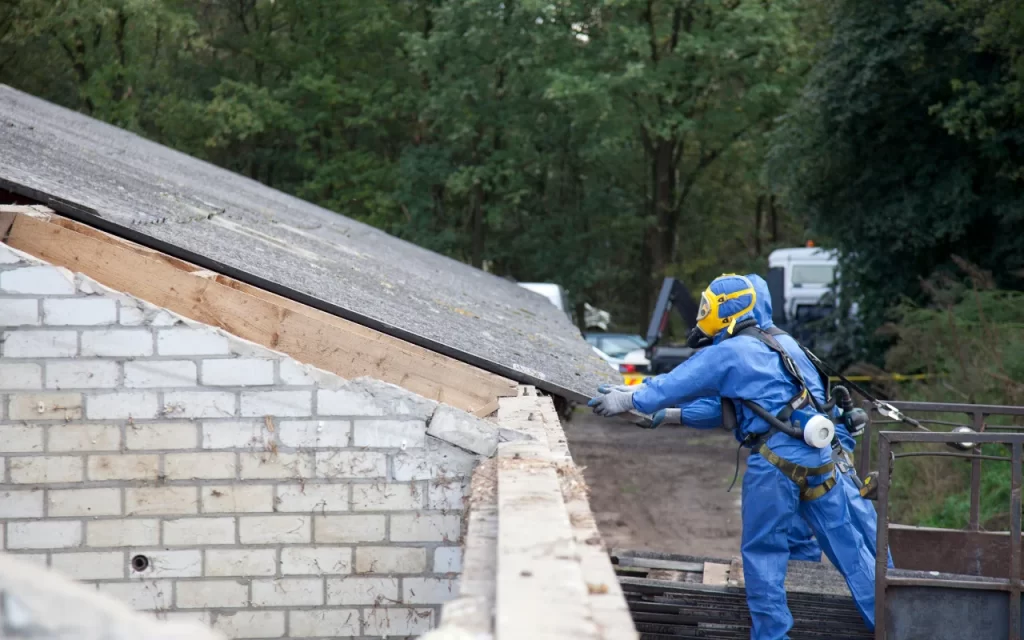 Home inspector using a test kit to check for asbestos in ceiling tiles